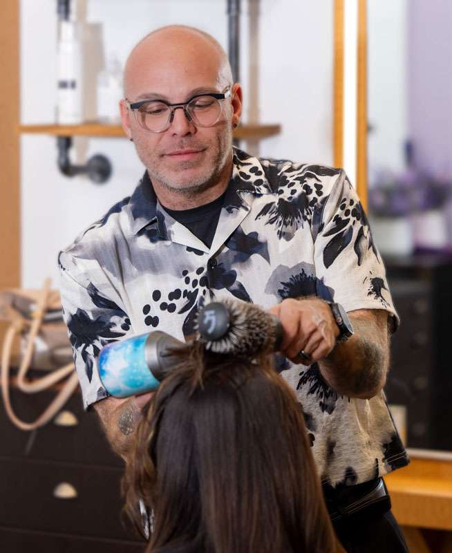 Happy Salon 730 client showing healthy styled hair