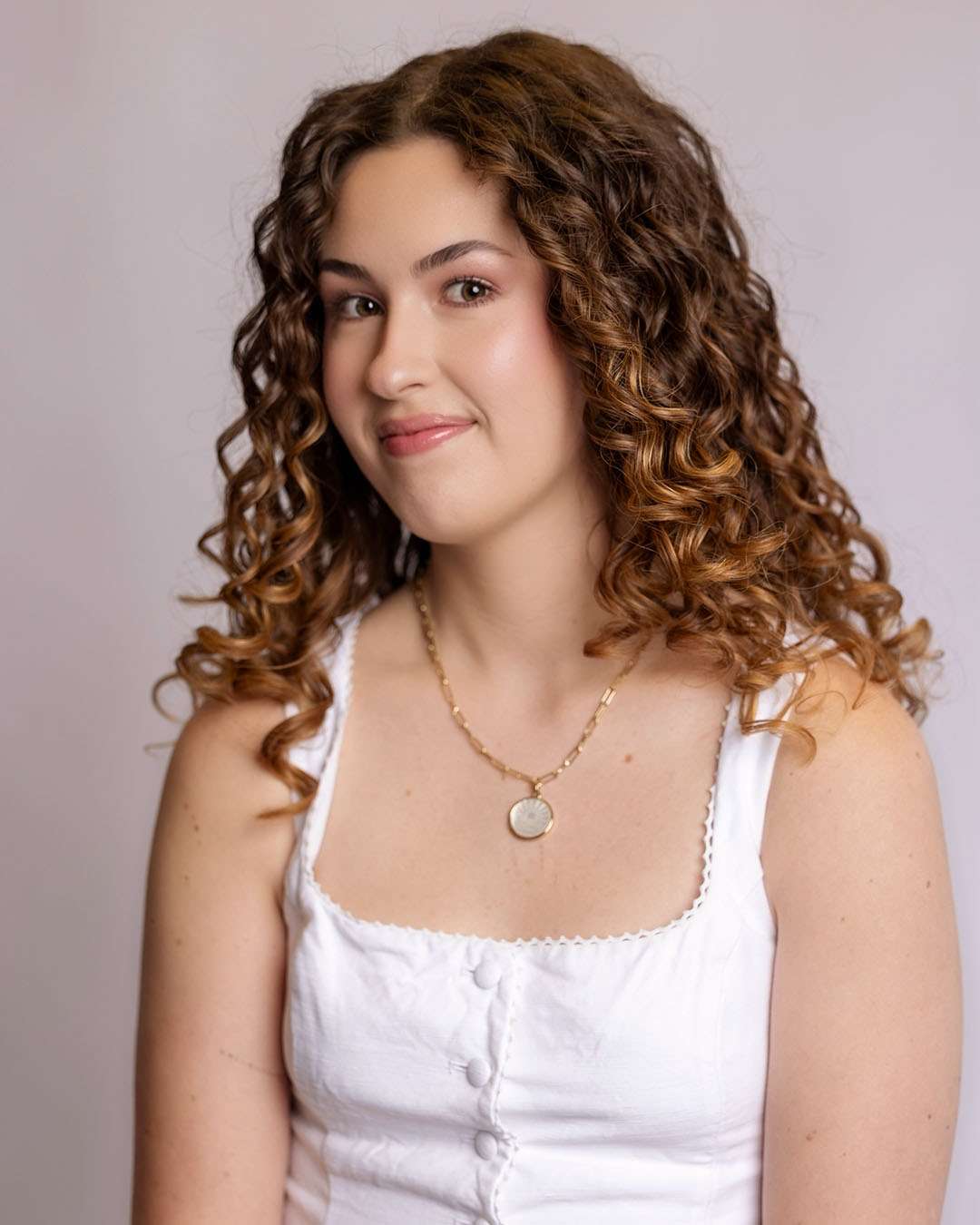 Courtney, hairstylist at Salon 730 in Fredericksburg VA smiling