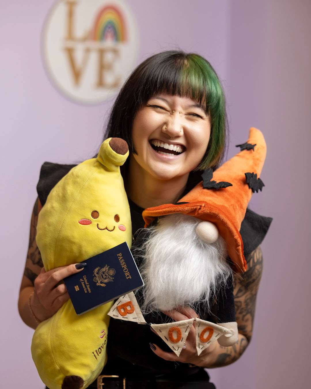 Jen, hairstylist at Salon 730 in Fredericksburg VA holding stuffed plushies