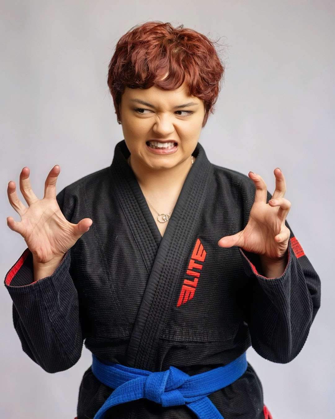 Naysa, hairstylist at Salon 730 in Fredericksburg VA wearing a karate gi